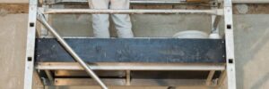 professional painter maintaining commercial paint job