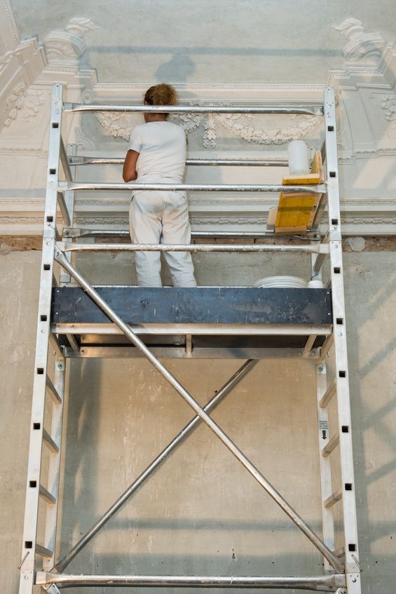 professional painter maintaining commercial paint job